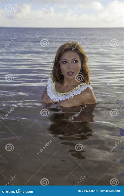 Young <b>beautiful</b> woman <b>topless</b> with long hair and white shirt in the sea. . Topless beautiful girl
